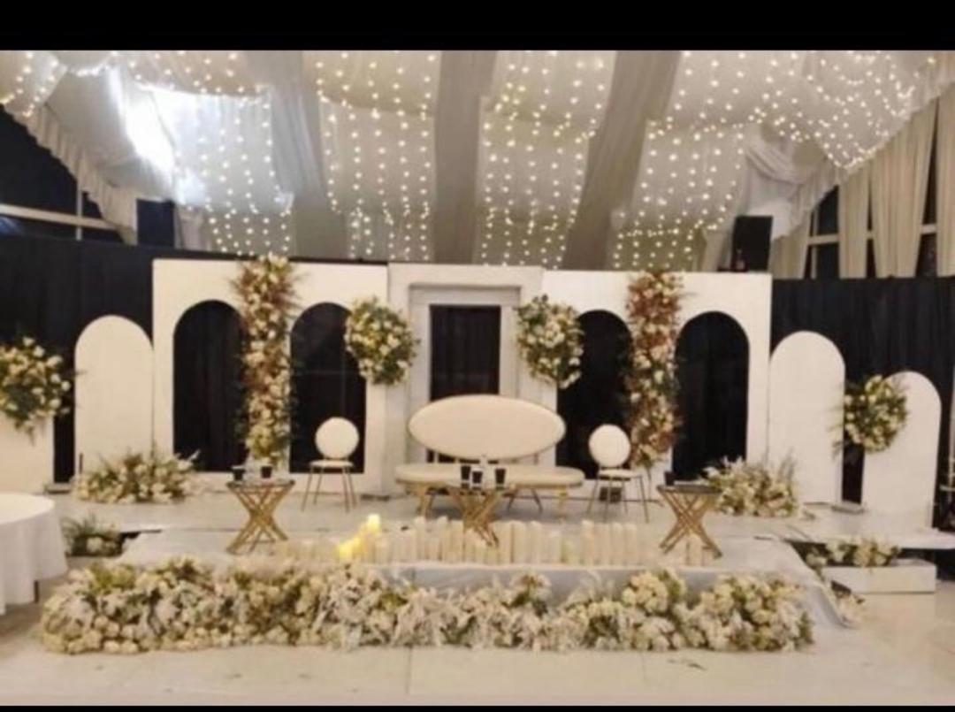 Black and white reception stage with fairy lights