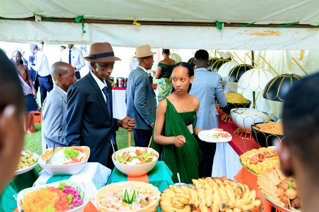 Guests at a catered buffet with elegant serving bowls